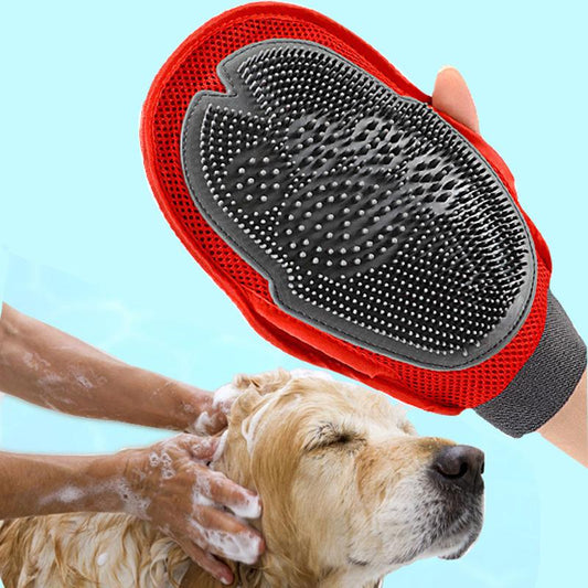 Pet grooming brush with red handle and gray surface being used on a dog's head against a light blue background