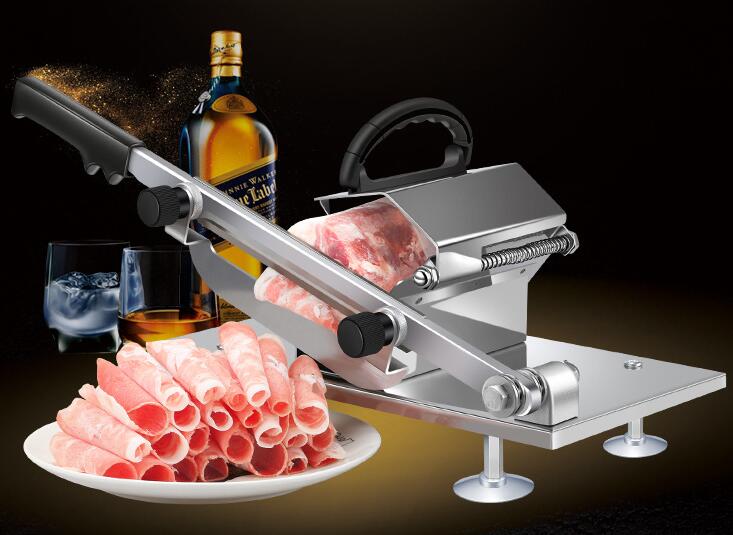 Meat slicer with sliced meat, a bottle of whiskey, and glasses on a dark background