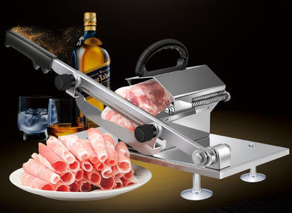 Meat slicer with sliced meat, a bottle of whiskey, and glasses on a dark background